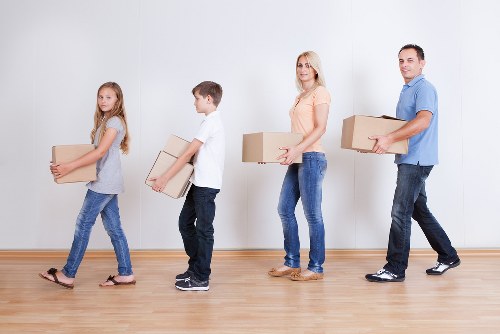 Professional moving team loading furniture for a Sydenham relocation